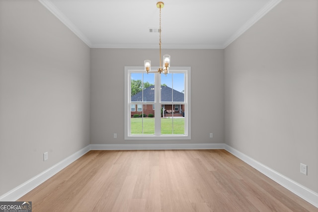 10 Honeysuckle Dr, Claxton, GA 30417 - empty room with light wood-type flooring, a chandelier, and crown molding