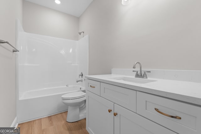 10 Honeysuckle Dr, Claxton, GA 30417 - full bathroom featuring vanity, washtub / shower combination, and wood finished floors