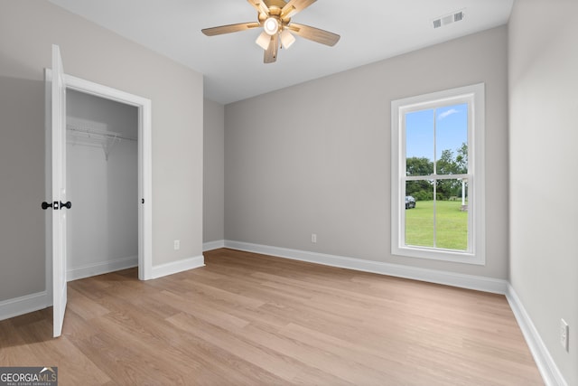 10 Honeysuckle Dr, Claxton, GA 30417 - unfurnished bedroom with light wood-type flooring, multiple windows, and a closet