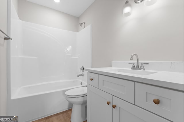 10 Honeysuckle Dr, Claxton, GA 30417 - full bathroom with vanity, wood finished floors, and tub / shower combination