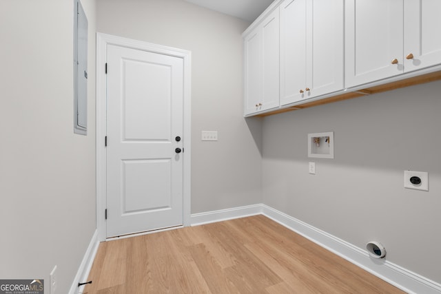 10 Honeysuckle Dr, Claxton, GA 30417 - laundry area with electric dryer hookup, cabinet space, light wood finished floors, and hookup for a washing machine