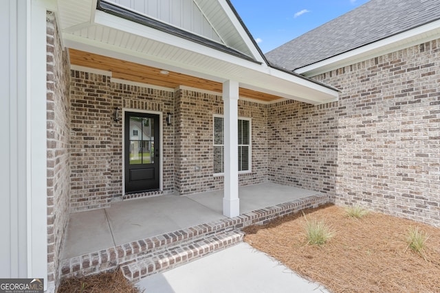 10 Honeysuckle Dr, Claxton, GA 30417 - doorway to property featuring brick siding, board and batten siding, and a shingled roof