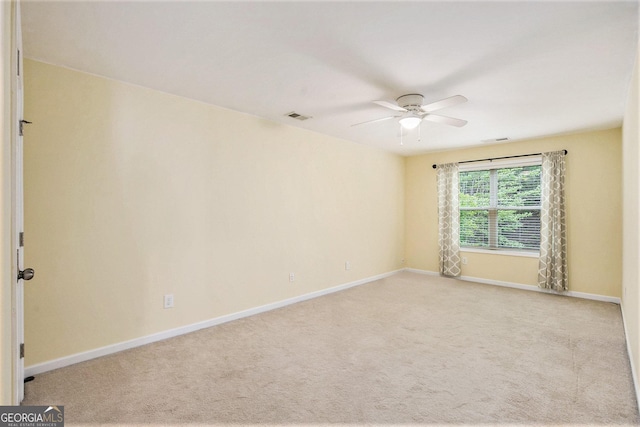 113 Macalester Dr, Newnan, GA 30265 - spare room featuring a ceiling fan and light colored carpet