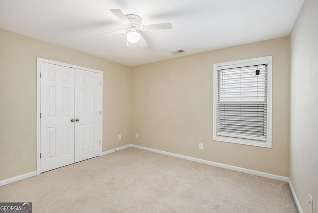 113 Macalester Dr, Newnan, GA 30265 - unfurnished bedroom featuring carpet flooring, a closet, and ceiling fan
