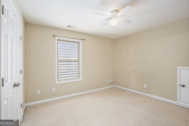 113 Macalester Dr, Newnan, GA 30265 - unfurnished bedroom featuring light colored carpet and a ceiling fan