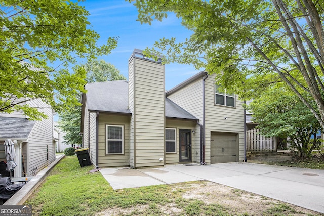 113 Macalester Dr, Newnan, GA 30265 - mid-century modern home with an attached garage, driveway, a chimney, a shingled roof, and a front yard