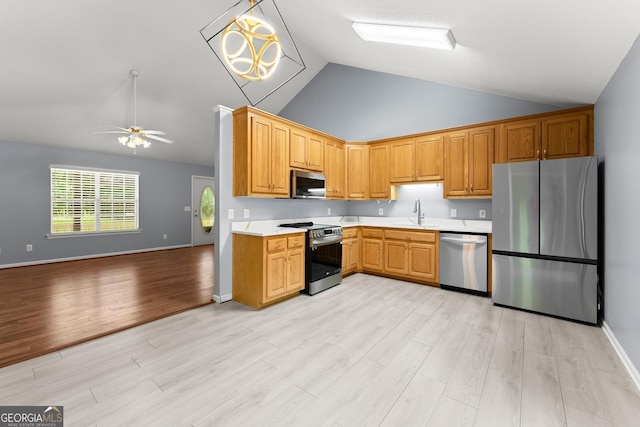 132 J Mountain Dr, Dahlonega, GA 30533 - kitchen with appliances with stainless steel finishes, a ceiling fan, light countertops, open floor plan, and light wood-style floors