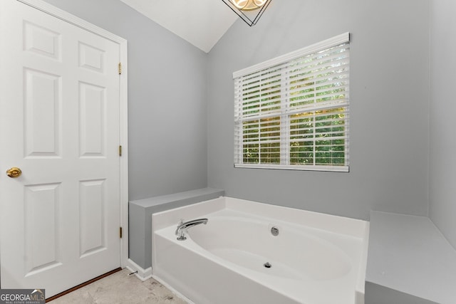 132 J Mountain Dr, Dahlonega, GA 30533 - bathroom featuring vaulted ceiling and a garden tub