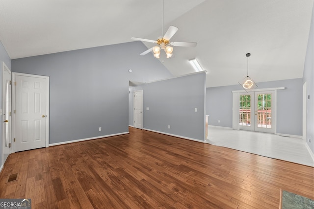 132 J Mountain Dr, Dahlonega, GA 30533 - unfurnished living room with high vaulted ceiling, a ceiling fan, and wood finished floors