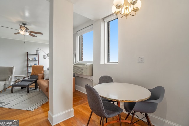 75 Ponce De Leon Ave NE Unit 1004, Atlanta, GA 30308 - dining area with ceiling fan, light wood-style flooring, a chandelier, and cooling unit