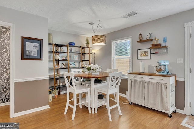 289 Westland Way SW, Marietta, GA 30064 - dining area with light wood-style floors and a textured ceiling