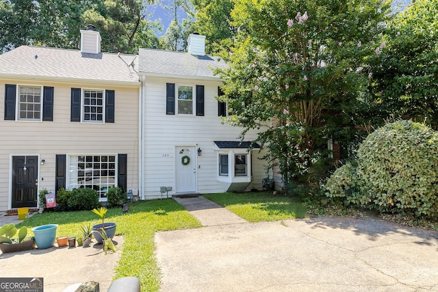 289 Westland Way SW, Marietta, GA 30064 - view of property with a chimney, a front yard, and roof with shingles