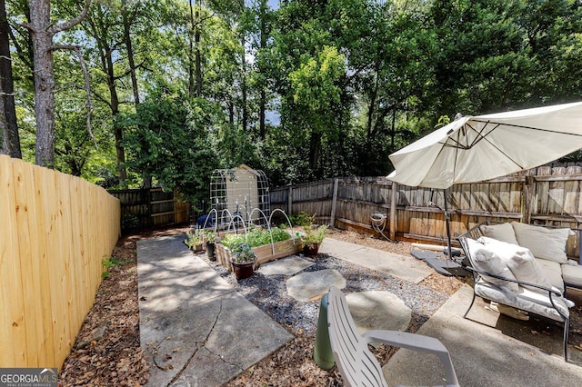 289 Westland Way SW, Marietta, GA 30064 - fenced backyard with a garden, a patio area, and an outdoor living space