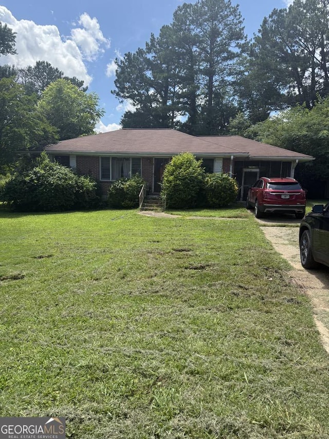 2941 Gresham Rd SE, Atlanta, GA 30316 - ranch-style home with a front yard and brick siding