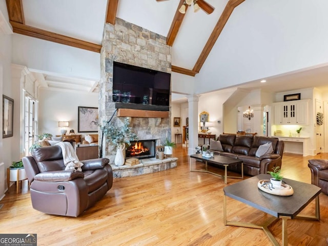 2392 Crimson King Dr, Braselton, GA 30517 - living room featuring a fireplace, beam ceiling, ceiling fan, high vaulted ceiling, and ornate columns
