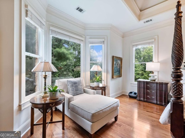 2392 Crimson King Dr, Braselton, GA 30517 - sitting room with ornamental molding and light wood-style flooring