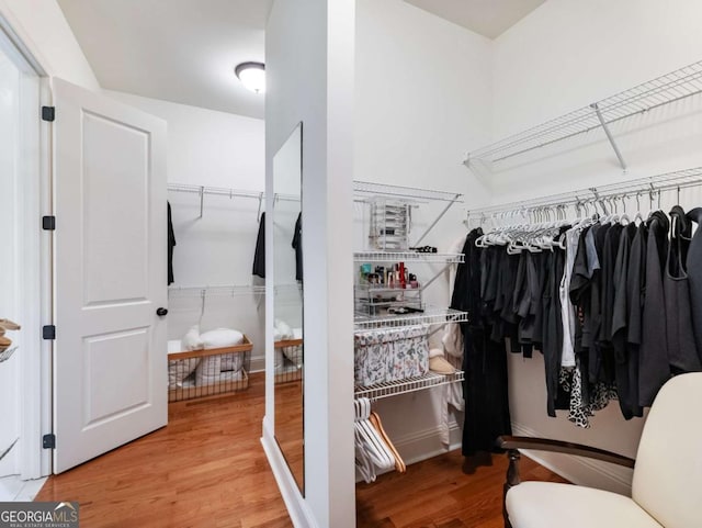 2392 Crimson King Dr, Braselton, GA 30517 - walk in closet with wood finished floors