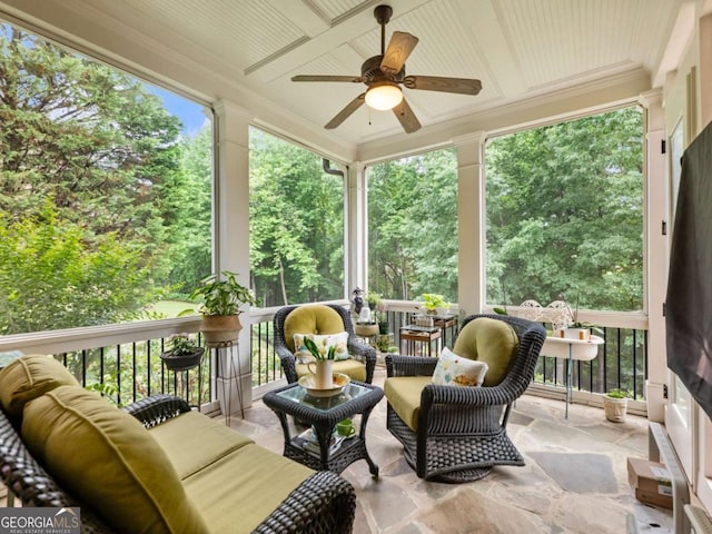 2392 Crimson King Dr, Braselton, GA 30517 - sunroom / solarium with an outdoor living space, a ceiling fan, coffered ceiling, and view of scattered trees