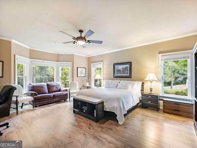 2392 Crimson King Dr, Braselton, GA 30517 - bedroom with wood finished floors, multiple windows, crown molding, and ceiling fan