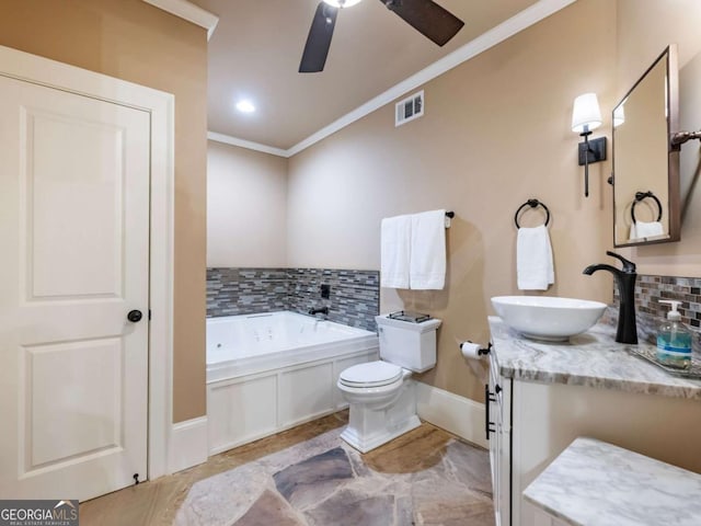 2392 Crimson King Dr, Braselton, GA 30517 - bathroom featuring crown molding, a whirlpool tub, vanity, decorative backsplash, and ceiling fan