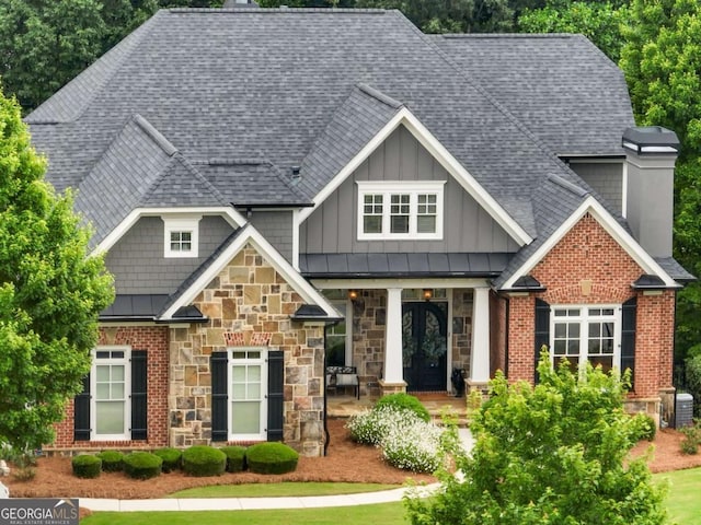 2392 Crimson King Dr, Braselton, GA 30517 - craftsman-style house with a chimney, stone siding, and roof with shingles