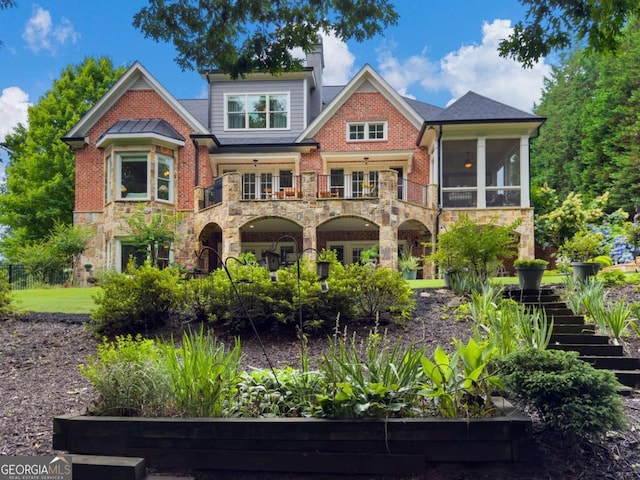 2392 Crimson King Dr, Braselton, GA 30517 - rear view of property with stairway, stone siding, a balcony, and a sunroom