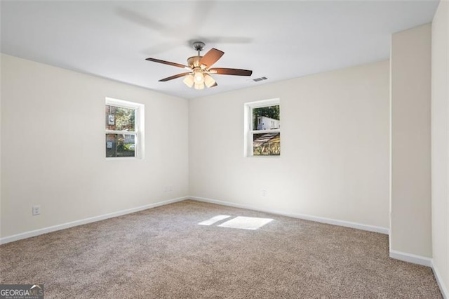 1270 Graymont Dr, Atlanta, GA 30310 - spare room featuring carpet floors, plenty of natural light, and ceiling fan