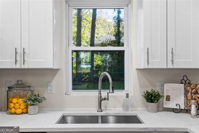 1270 Graymont Dr, Atlanta, GA 30310 - kitchen with white cabinetry and light stone counters