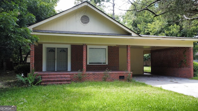 9 Henry St, Statesboro, GA 30458 - bungalow-style house with driveway, a porch, a front lawn, an attached carport, and brick siding