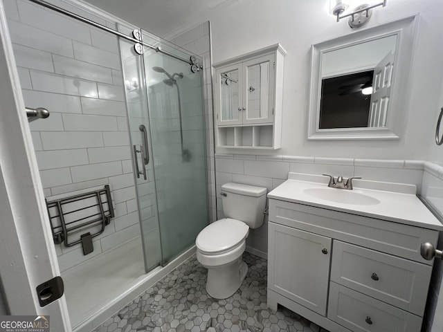 9 Henry St, Statesboro, GA 30458 - bathroom with a stall shower, vanity, tile patterned floors, ornamental molding, and tile walls