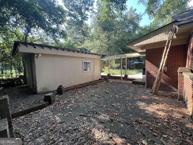 9 Henry St, Statesboro, GA 30458 - view of home's exterior with a patio and brick siding