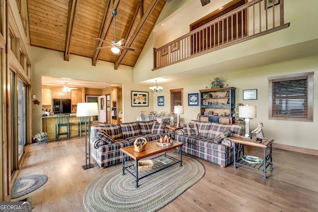 4 Dean Ln, Tiger, GA 30576 - living room featuring ceiling fan, high vaulted ceiling, light wood-type flooring, a wooden ceiling with exposed beams, and a chandelier