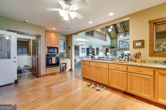 4 Dean Ln, Tiger, GA 30576 - kitchen with black appliances, ceiling fan, light wood finished floors, a chandelier, and light stone counters