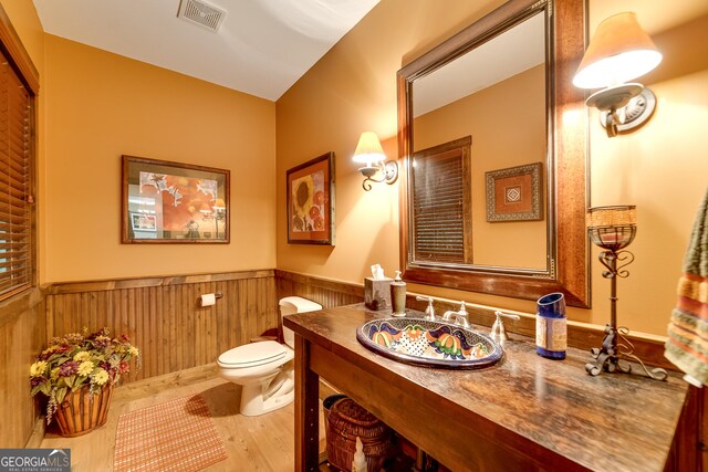 4 Dean Ln, Tiger, GA 30576 - half bath with a wainscoted wall, vanity, and wood finished floors