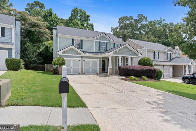 1609 Vinery Ln SE, Mableton, GA 30126 - view of front facade with concrete driveway, a garage, and a porch
