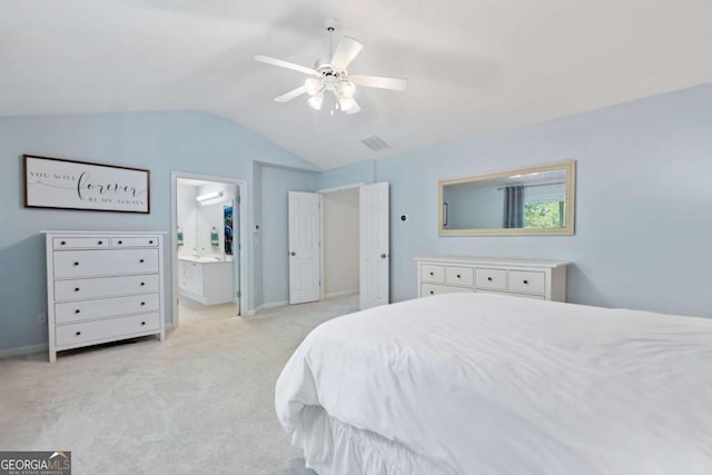 1609 Vinery Ln SE, Mableton, GA 30126 - bedroom featuring vaulted ceiling, light carpet, ensuite bath, and a ceiling fan