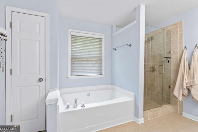 1609 Vinery Ln SE, Mableton, GA 30126 - full bath with a stall shower, a garden tub, and tile patterned floors