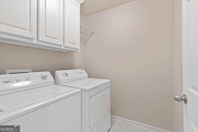 1609 Vinery Ln SE, Mableton, GA 30126 - laundry room featuring washer and clothes dryer, cabinet space, and light floors