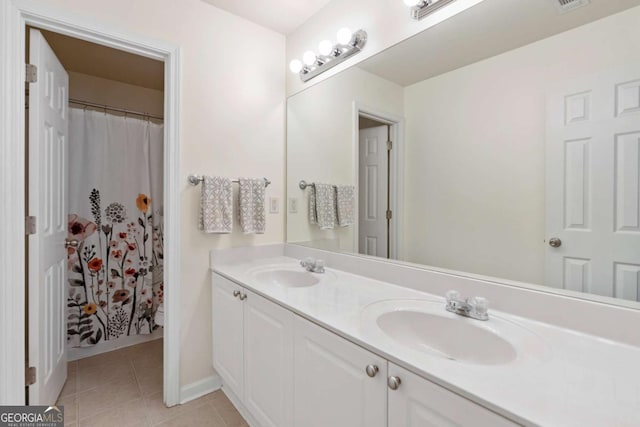 1609 Vinery Ln SE, Mableton, GA 30126 - bathroom with double vanity and tile patterned floors