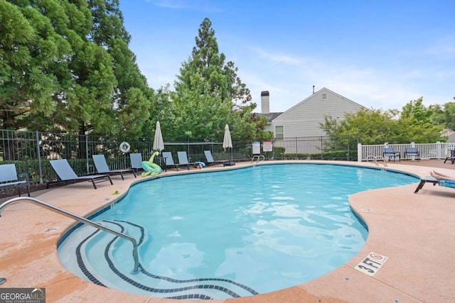1609 Vinery Ln SE, Mableton, GA 30126 - community pool featuring a patio