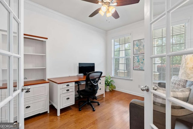 1609 Vinery Ln SE, Mableton, GA 30126 - office area featuring crown molding, a ceiling fan, light wood finished floors, and french doors
