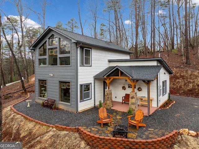 180 Echo Ln Unit 692, Ellijay, GA 30540 - rear view of property featuring an outdoor fire pit and a shingled roof