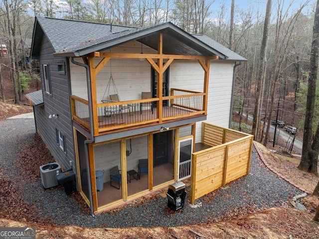 180 Echo Ln Unit 692, Ellijay, GA 30540 - back of house featuring a sunroom, roof with shingles, and a balcony