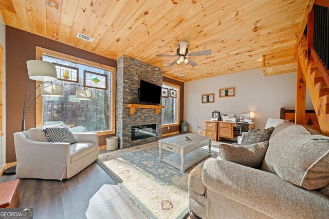 180 Echo Ln Unit 692, Ellijay, GA 30540 - living room featuring wood finished floors, wood ceiling, a stone fireplace, and ceiling fan