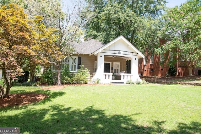1557 18th Ave, Columbus, GA 31901 - view of front of property with a front lawn and board and batten siding
