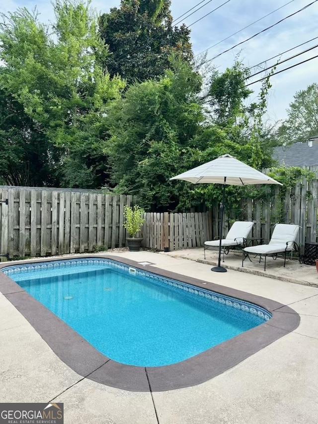 1557 18th Ave, Columbus, GA 31901 - view of pool with a patio and a fenced backyard
