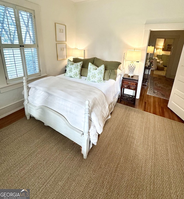 1557 18th Ave, Columbus, GA 31901 - bedroom with wood finished floors and baseboards