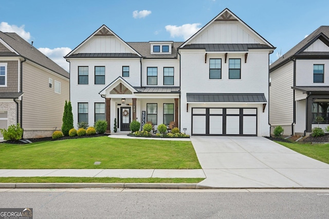 4189 Brookmont Way, Auburn, GA 30011 - modern farmhouse with board and batten siding, a standing seam roof, concrete driveway, and a front yard
