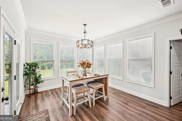 4189 Brookmont Way, Auburn, GA 30011 - dining room featuring ornamental molding, a chandelier, and dark wood-style floors