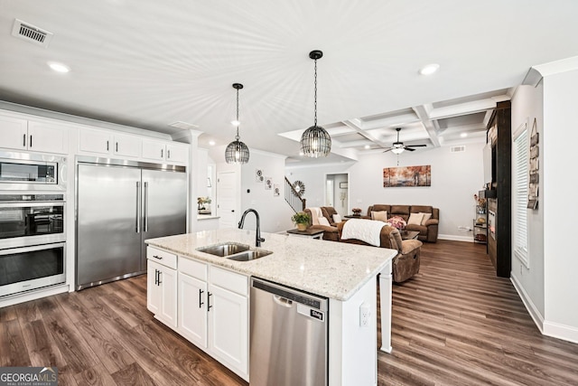 4189 Brookmont Way, Auburn, GA 30011 - kitchen featuring built in appliances, recessed lighting, dark wood-style floors, an island with sink, and pendant lighting